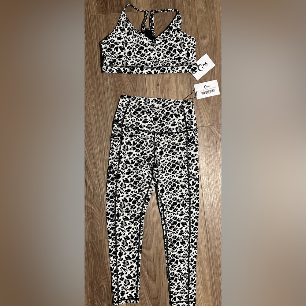 New with tags Zyia set. Bra XL. Pants 6-8. Print is snow leopard